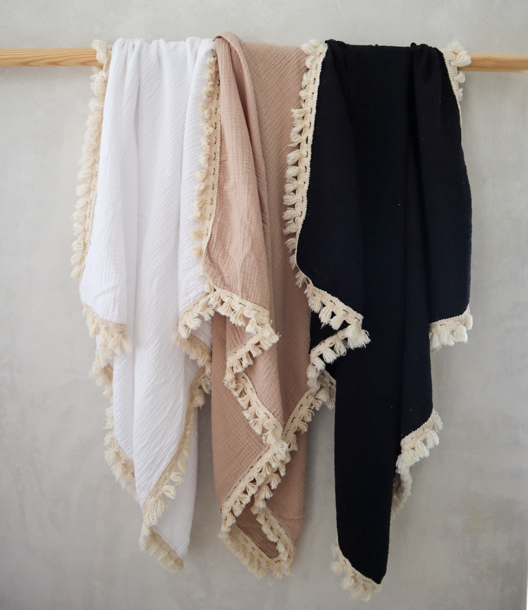 Wanderlust collection: Muslin swaddle with natural fringe detail.