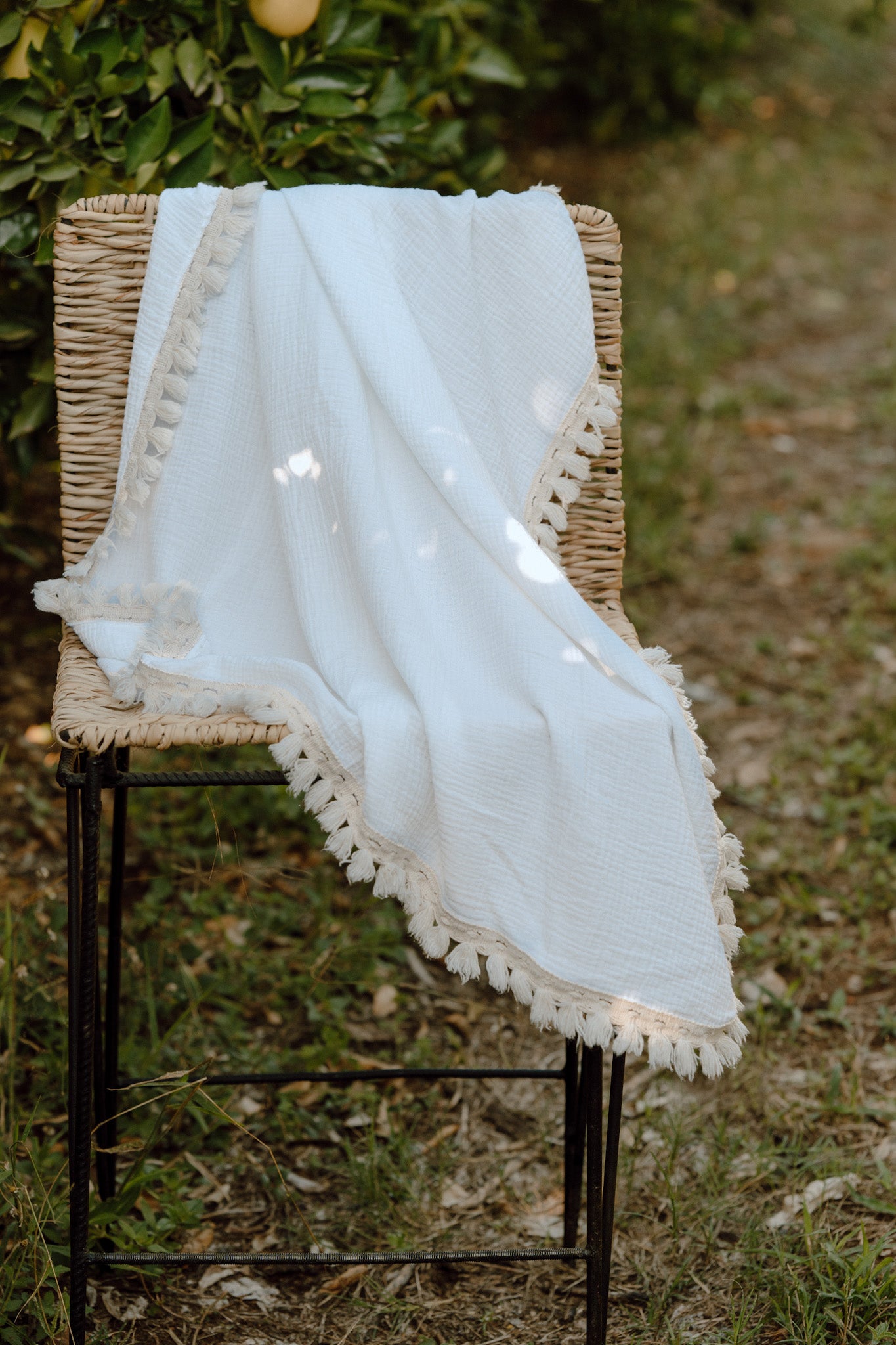 Wanderlust collection: Muslin swaddle with natural fringe detail.